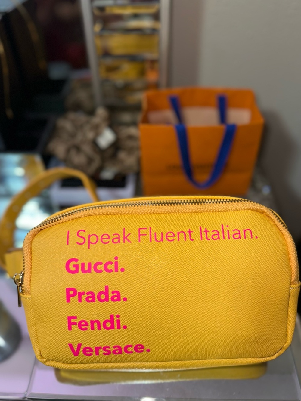 Yellow Crossbody Pouch with Pink Logo Text